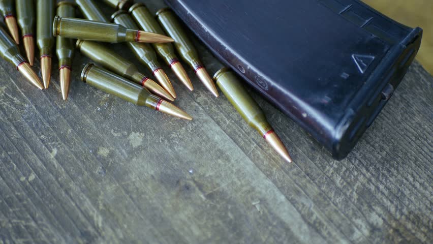 There are cartridges and a machine clip on the table.