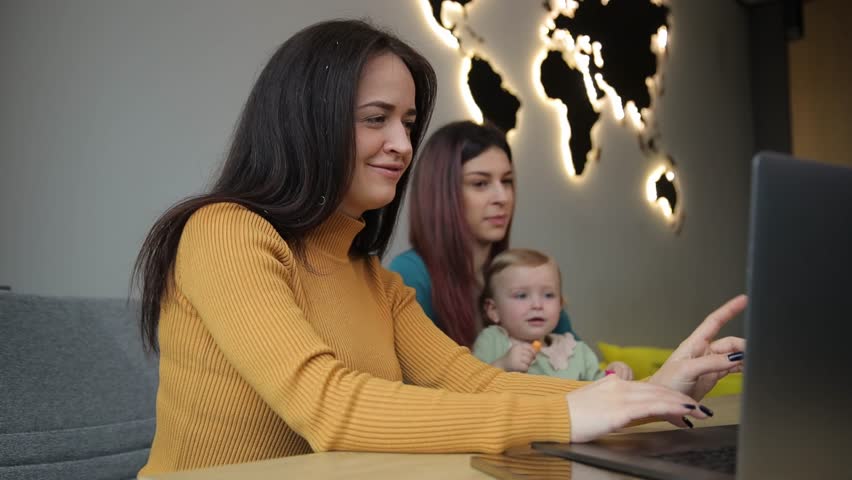 A travel agent helps you choose a holiday tour at a travel agency