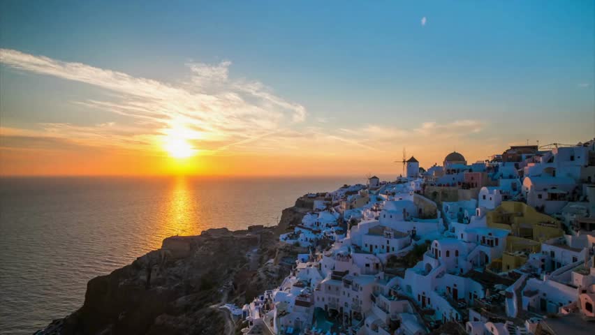 Dawn over Antarctic coast. Polar night sunset. Ocean covered ice. Top above aerial view. Antarctica snow mountain. Sky sunrise Antarctica winter. Open water. Beautiful sky landscape. Top Drone Fligh