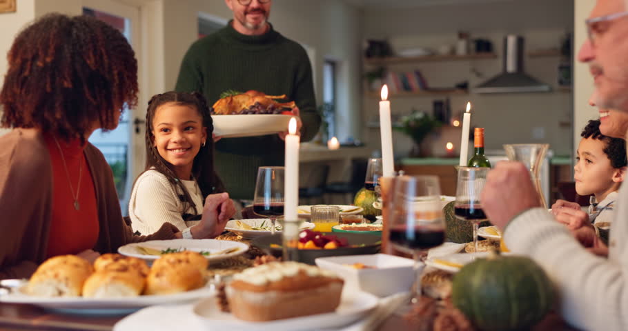 Man, serving and turkey with celebration for thanksgiving with happy family, feast and food for festive dinner or holiday. Interracial, people and together in house with meal, gratitude and applause.