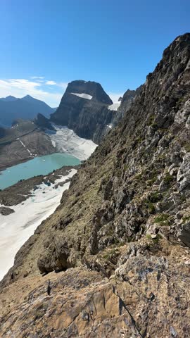 Vertical View. Glacier and Glacial Lake on Sunny Summer Day, Glacier National Park, Montana USA
