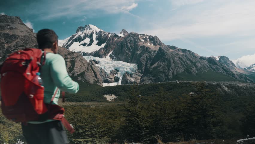 Man Hiking Towards Mt. Fitz Roy In Patagonia, Argentina - Wide Shot