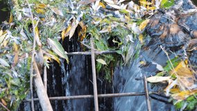 Pollution with garbage floating in a water stream in 4k slow motion 60fps - Powered by Shutterstock - Get 15% off with code: PIKWIZARD15