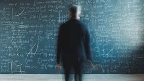 Zoom-in time lapse of scientist mature man writing numbers and formulas on chalkboard in university hall. Professional occupation and science concept. - Powered by Shutterstock - Get 15% off with code: PIKWIZARD15