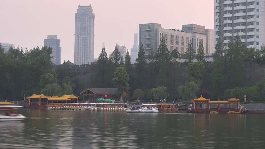 NANJING, CHINA - APRIL 30, 2012, Fast motion of Nanjing skyline and Xuanwu Lake in twilight