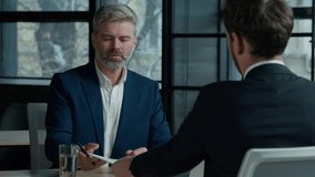 Man client insurance agent signing business contract make agreement hiring hire job two Caucasian men businessmen in negotiation meeting partners sign finance deal paper document teamwork interview - Powered by Shutterstock - Get 15% off with code: PIKWIZARD15
