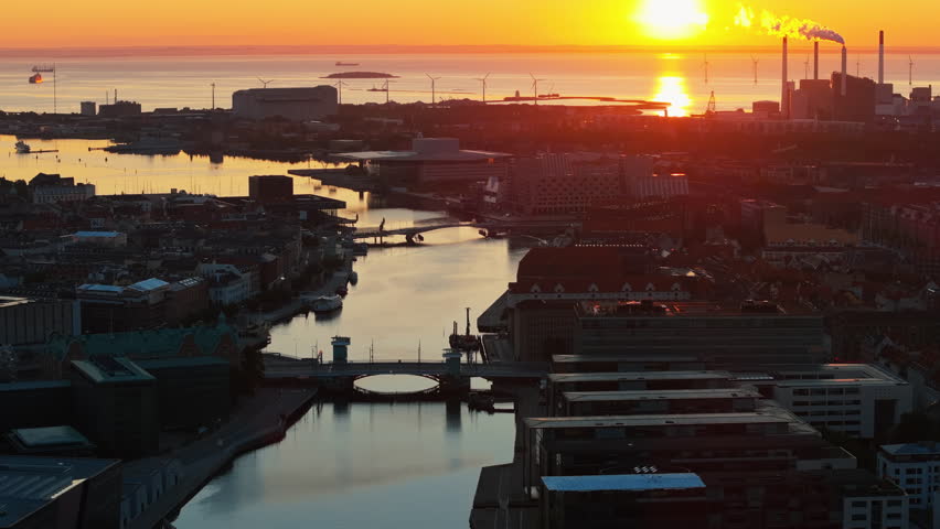 Aerial drone view of the city centre of Copenhagen harbour in Denmark at sunset