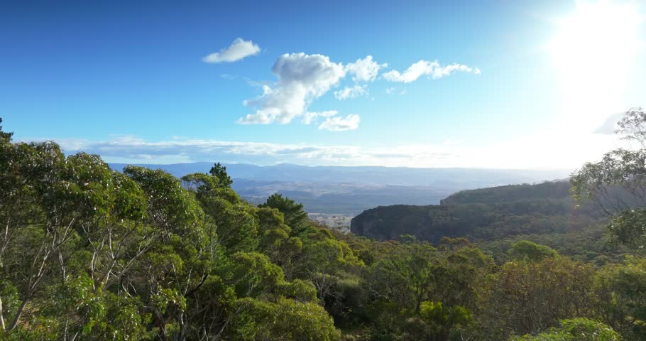 Various aerial camera movements looking into the Australian countryside from the mountains.