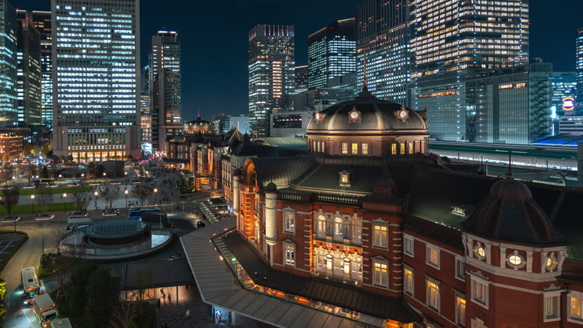 Timelapse sequence showing historic landmark Tokyo Station at night in the Marunouchi District of Tokyo, Japan, dolly left. 