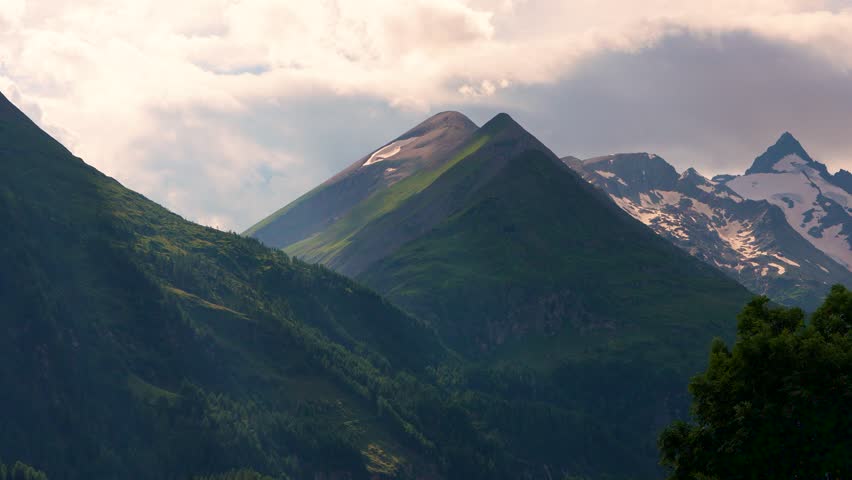 Morning atmosphere. Slopes and peaks of snow and ice on the Grossglockner mountain. Hohe Tauern National Park. Austria