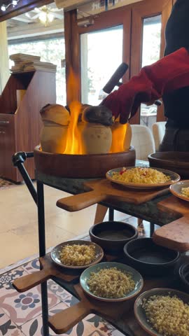 Cook preparing typical Turkish food with flames