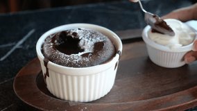 Delicious Chocolate Lava Cake with Powdered Sugar and Whipped Cream on Wooden Plate - Powered by Shutterstock - Get 15% off with code: PIKWIZARD15