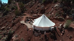Drone Shot of Young Woman Going Out From Yurt Tent in Glamping Area and Landscape of Zion National Park, Utah USA - Powered by Shutterstock - Get 15% off with code: PIKWIZARD15