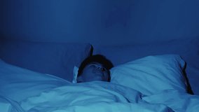 Bad dream. Night horror. Sleep anxiety. Frightened man woke up in bed from nightmare of creepy evil demon hand shadow in dark bedroom. - Powered by Shutterstock - Get 15% off with code: PIKWIZARD15