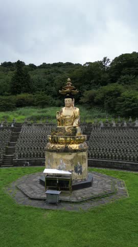 Gwaneumsa Temple, Buddha Statue in Jeju City, Jeju Island, South Korea. Aerial Drone View. RAW shooting - no filter.