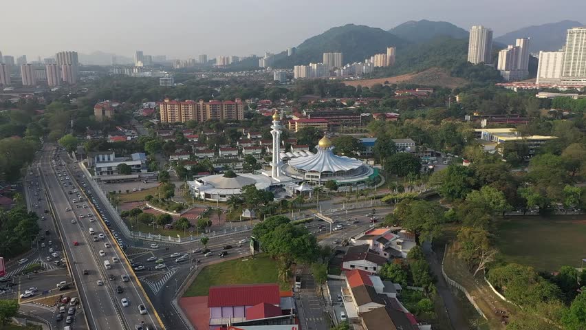 The Penang State Mosque, located in George Town, Penang, Malaysia, is a prominent religious landmark known for its stunning Moorish architectural style. Completed in 1978, it features elegant domes, m