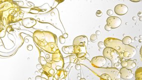 Super Slow Motion Shot of Golden Oil Flowing in Water on White Background at 1000fps. - Powered by Shutterstock - Get 15% off with code: PIKWIZARD15