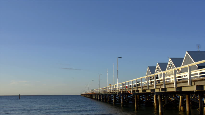 The famous Busselton Jetty alit by the late afternoon sun on a clear spring day,