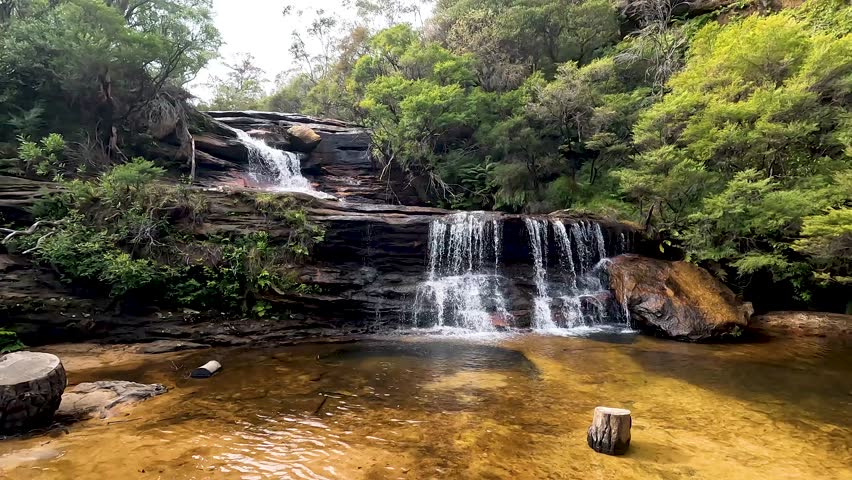 Landscape of Wentworth Falls is a three-tiered waterfall fed by the Jamison Creek, near the town of Wentworth Falls in the Blue Mountains region of New South Wales Australia - Nature Track Sydney Trip