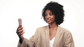 Businesswoman Greeting on Video Call Using Smartphone - Powered by Shutterstock - Get 15% off with code: PIKWIZARD15