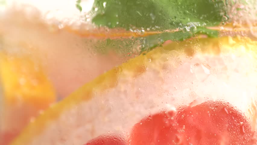 Grapefruit slices in fizzy sparkling tonic with bubbles, juice refreshment carbonated soft drink. Summer time, mojito cocktail. 