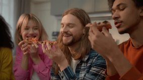 Happy laughing multiracial friends diversity people multiethnic buddies students teenagers African American female women girls Caucasian guys male man eating pizza food delivery together snack tasty - Powered by Shutterstock - Get 15% off with code: PIKWIZARD15