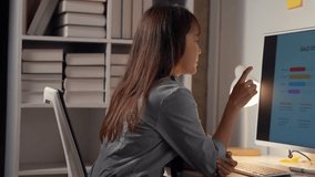 Stressed businesswoman reviews declining sales data on computer, feeling anxious in office. Financial charts show declining product sales - Powered by Shutterstock - Get 15% off with code: PIKWIZARD15