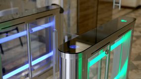 A professional businesswoman uses her personal access card to smoothly enter her workplace through a modern turnstile in a stylish office lobby. Perfect for themes of office security - Powered by Shutterstock - Get 15% off with code: PIKWIZARD15