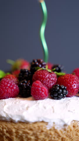 Birthday Cake With Burning   Candle  
Bday concept birthday cake with one candle Tasty cake with berries