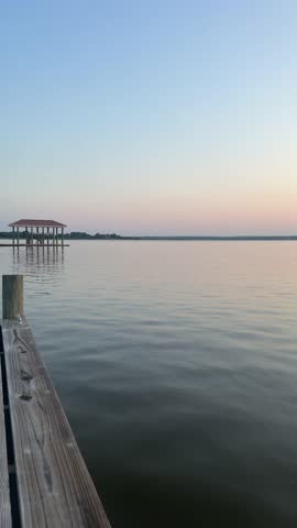 Rappahannock River, Virginia, USA - Sunrise on the calm waters of the Rappahannock River in Tappahannock, Virginia on the middle peninsula looking over at the Northern Neck