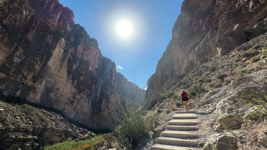 Woman Hiking in Santa Elena Canyon, Trail Above Rio Grande in Big Bend National Park, Texas USA