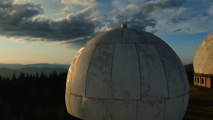 Pamir old military radar station. Aerial view of abandoned secret army site, former radio locating station, Carpathian mountains, Ukraine. Futuristic architecture buildings in forest.