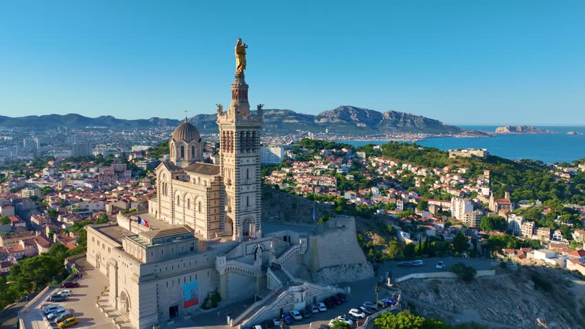 aerial view of Notre-Dame de la Garde in Marseille aerial view, establishing shot of French town of Marseille, travel and tourism in France. High quality 4k footage