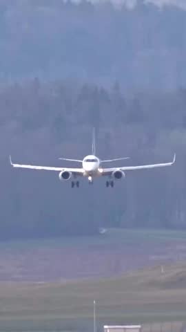 Passenger airplane jet landing at generic airport regional aircraft crosswind conditions white unmarked