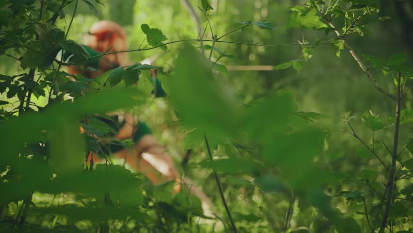 Fantasy strong warrior woman amazon hunts in fairy tale mystery forest green grass sun light, sexy eyes girl hunter holds long bow in hands aims arrow. braid orange hair. fashion model posing art 4k.
