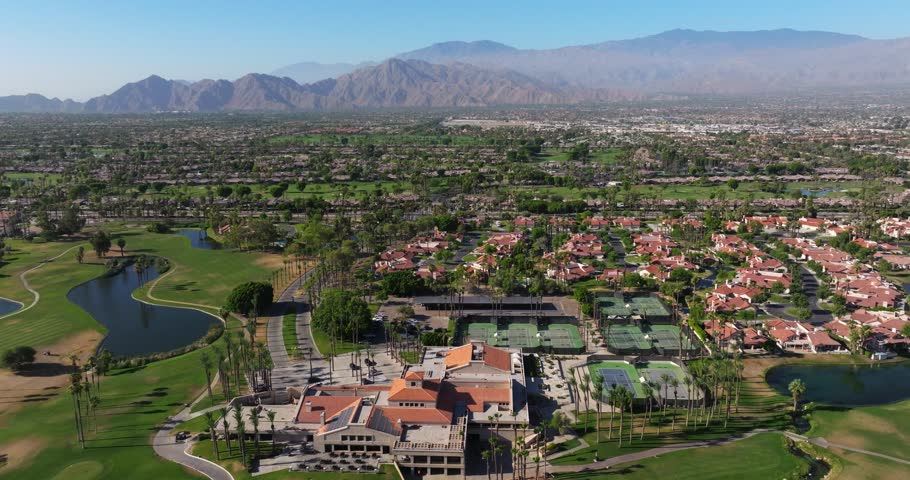 Aerial pullback above multi sport complex by golf course in Palm Springs California USA