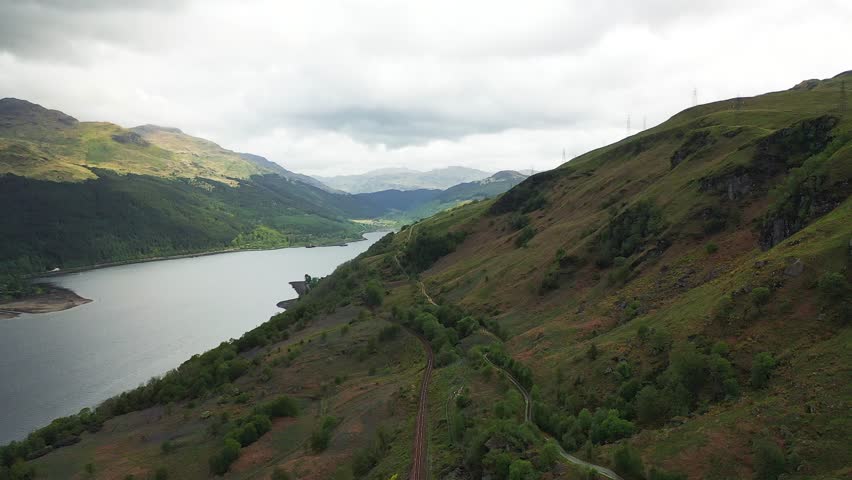 Aerial drone view over picturesque Scottish landscape. Mountains above Loch Long in Scottish Highlands, Scotland, United Kingdom.