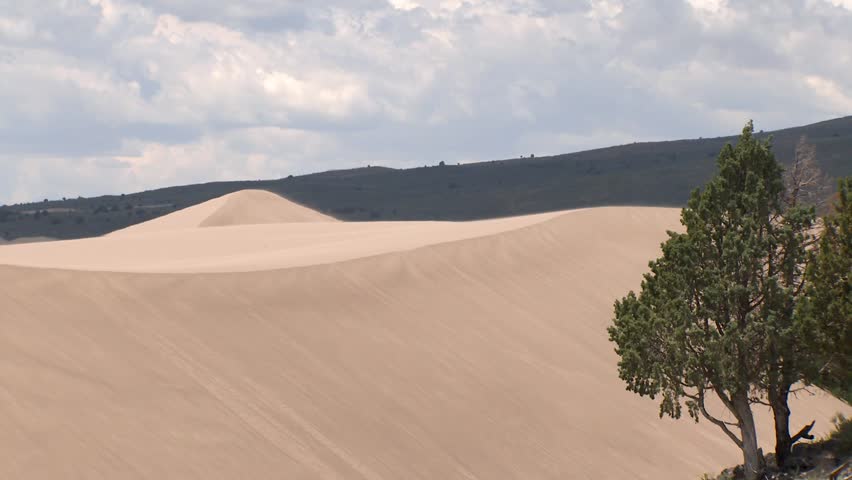Sun shining over the St. Anthony Sand Dunes in Idaho that attracts thousands of visitors each year.