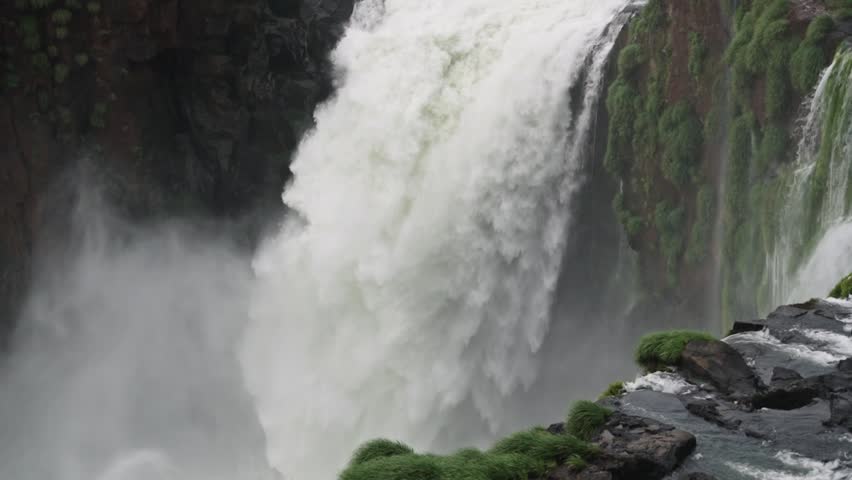 Close up of a big waterfall. View of the natural landmark. Slow-motion.