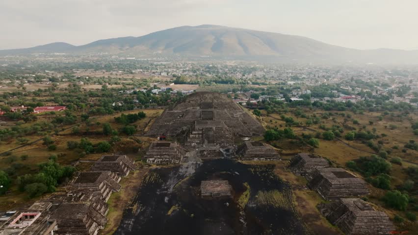 Backward aerial overlooking Pyramid of the Moon, Moon Plaza and the Jaguar Temple, Teotihuacan, Mexico