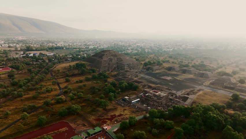 Early morning scenic panoramic view of the Pyramid of the Moon, Teotihuacan, Mexico. Pan left drone aerial