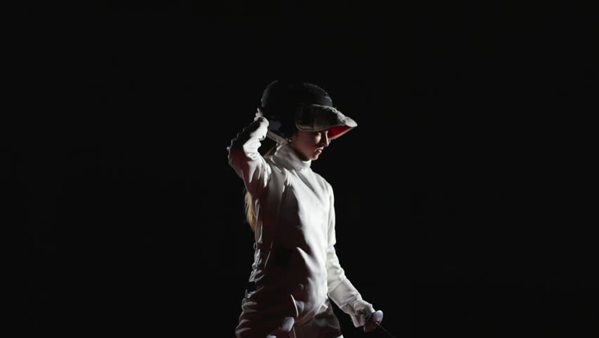 Silhouette Of Female Figure On Fencing Track, Fencer Putting Mask And Standing In Attack Position