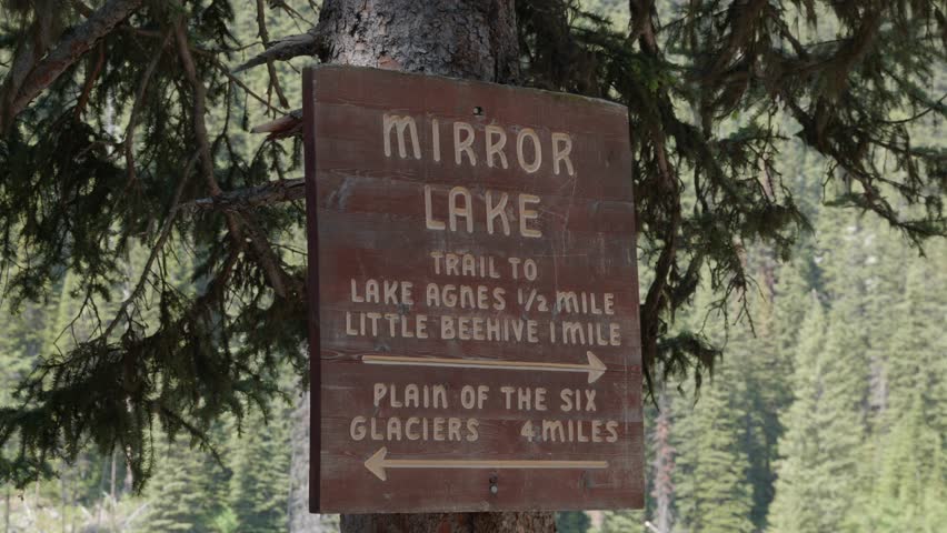 Mirror Lake Trail sign in Canada, scenic tourist spot in forested paths