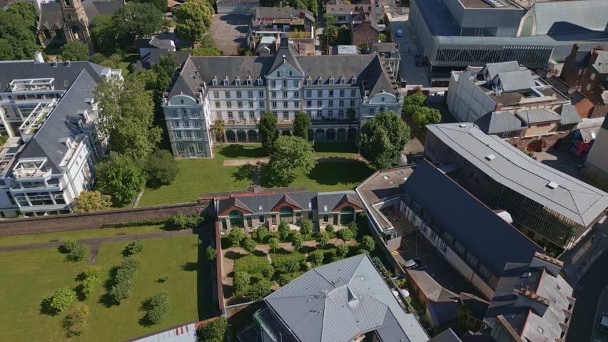 Beautiful residence with grarden near the Place Sainte Anne square and Jacobins convent, Rennes, France. Aerial drone forward