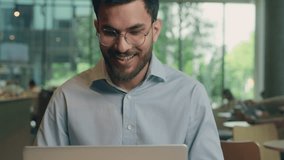 Indian businessman smiling ethnic guy Arabian business man freelancer entrepreneur working online computer laptop project distant studying happy positive smile male customer visitor in cafe restaurant - Powered by Shutterstock - Get 15% off with code: PIKWIZARD15