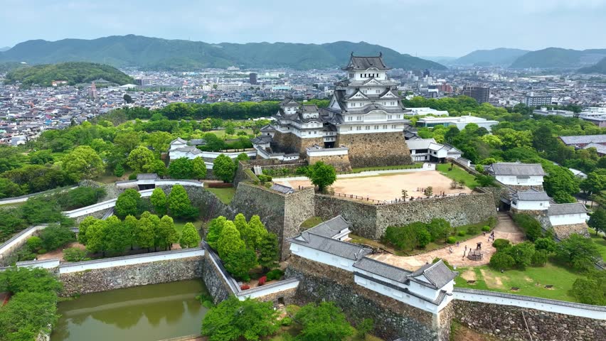 orbiting shot of Himeji castle in Japan, aerial view of a traditional Japanese samurai fort in Hyogo prefecture, travel in Japan, medieval castle of Himeji drone view. High quality 4k footage