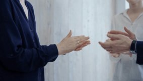 Diverse business team clapping hands in a modern office. Business people applauding with close up of hands - Powered by Shutterstock - Get 15% off with code: PIKWIZARD15