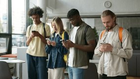 Multiracial students multiethnic diversity friends African men guys males Caucasian girl woman female high school university college social media addict using mobile phones dependency gadgets addicted - Powered by Shutterstock - Get 15% off with code: PIKWIZARD15