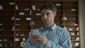 Sad adult Caucasian man businessman male guy student employee user holding mobile phone gadget frustrated bad news error problem broken smartphone losing wifi loss job online game business fail indoor - Powered by Shutterstock - Get 15% off with code: PIKWIZARD15