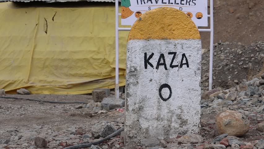 Bokeh footage of Kaza Milestone, Lahaul and Spiti, Himachal Pradesh, India with selective focus and copy space. Street of Kaza miletsone, the winterland of India.
